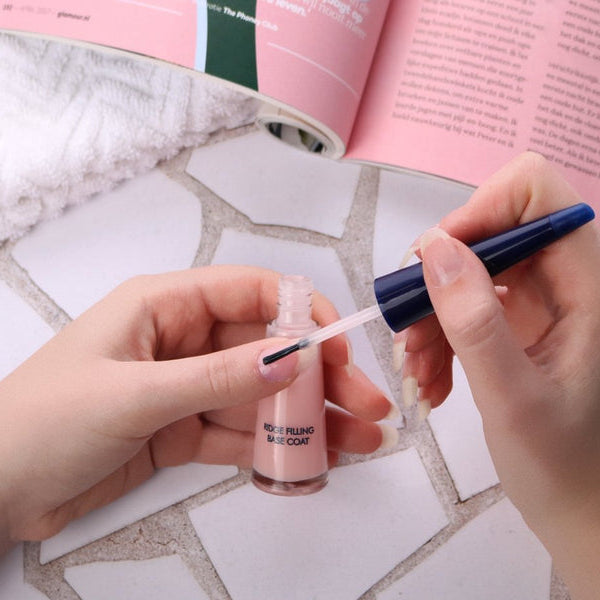 Herome Ridge Filling Base Coat applied to fingernails with a brush
