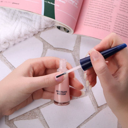 Herome Ridge Filling Base Coat applied to fingernails with a brush