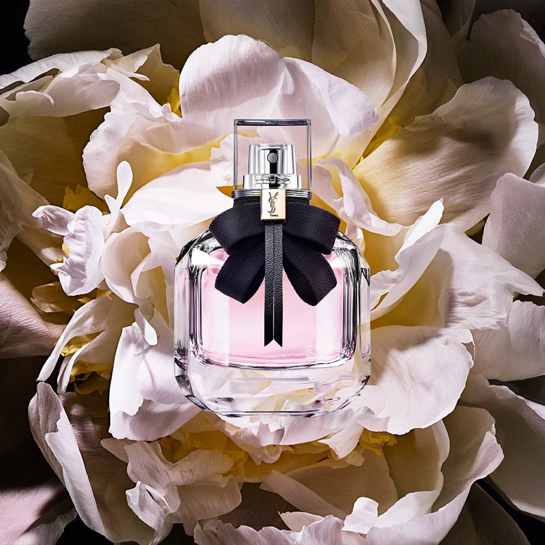 Yves Saint Laurent Mon Paris Eau de Parfum original bottle among peony petals